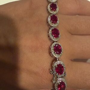 12.50CTW OVAL LAB CREATED RUBY WITH WHITE DIAMOND ACCENT RHODIUM OVER STERLING